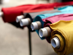 Rolls of fabrics in a variety of colours and prints